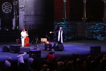 Lebanese composer and singer Marcel Khalife performs with cello player Sari Khalife during the Baalbek festival, which was held in La Magnanerie, a 19th century silk factory, in Beirut August 24, 2013. REUTERS/Jamal Saidi