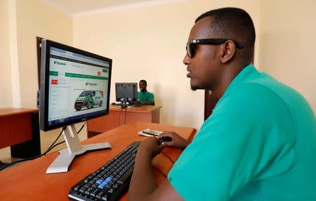 Employees at the Somali Online Market (SOOMAR) work inside their office in the Hodan district of Mogadishu, Somalia, October 17, 2018 REUTERS/Feisal Omar