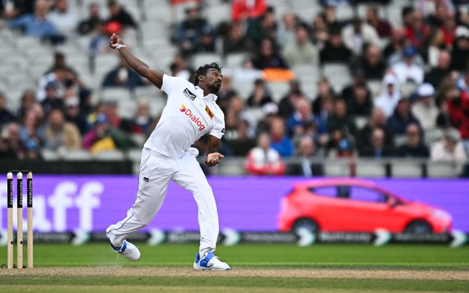 Sri Lanka's Milan Rathnayake bowls the ball on day two of the first Test match between England and Sri Lanka at Old Trafford cricket ground in Manchester, north-west England on August 22, 2024