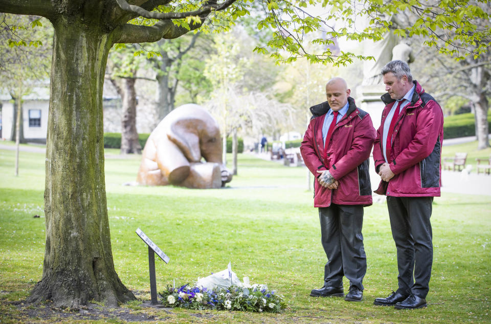 <p>George Brown (right) and Marvin Greenham, from Lothian Buses, reflect after laying a wreath at the workers memorial tree in West Princes Street Gardens, Edinburgh, to commemorate workers who died from Covid-19 and other illnesses or injuries as part of STUC International Workers Memorial Day. Picture date: Wednesday April 28, 2021.</p>
