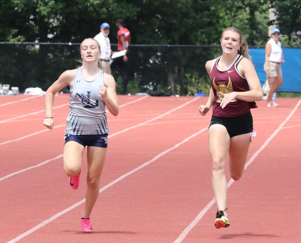 Riley Pettigrew from Arlington, second from right, competes in the girls 200 meter dash division 1, during the New York State Track and Field Championships at Middletown High School, June 10, 2023.