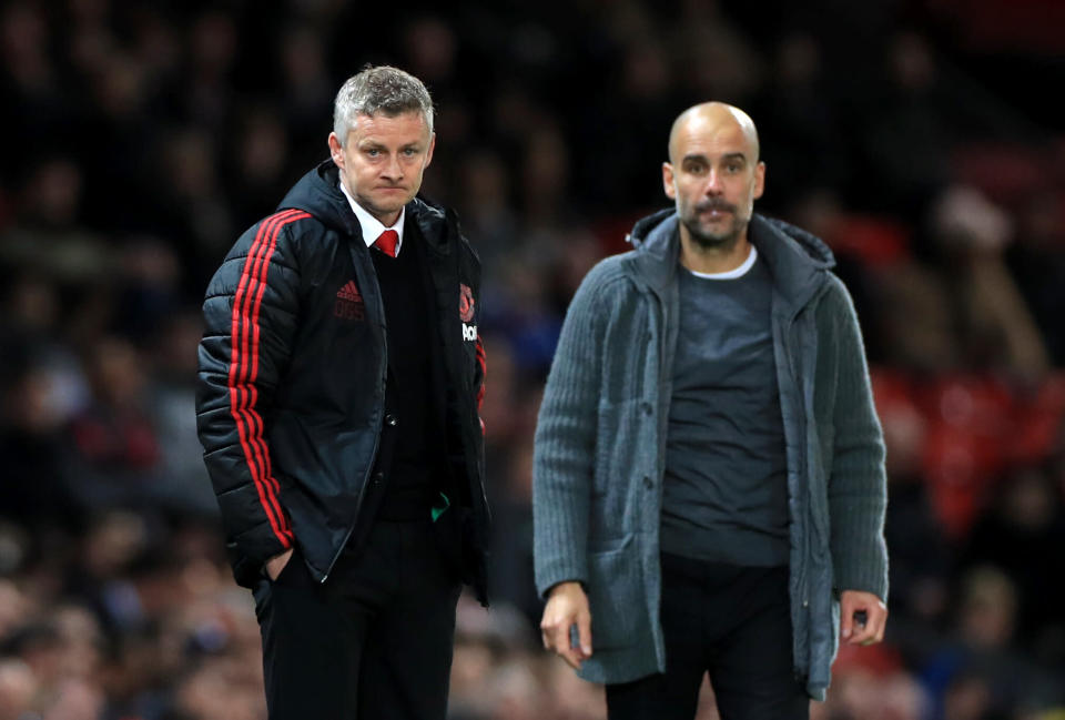 Manchester United manager Ole Gunnar Solskjaer (left) and Manchester City manager Pep Guardiola look on Manchester United v Manchester City - Premier League - Old Trafford 24-04-2019 . (Photo by  Mike Egerton/EMPICS/PA Images via Getty Images)