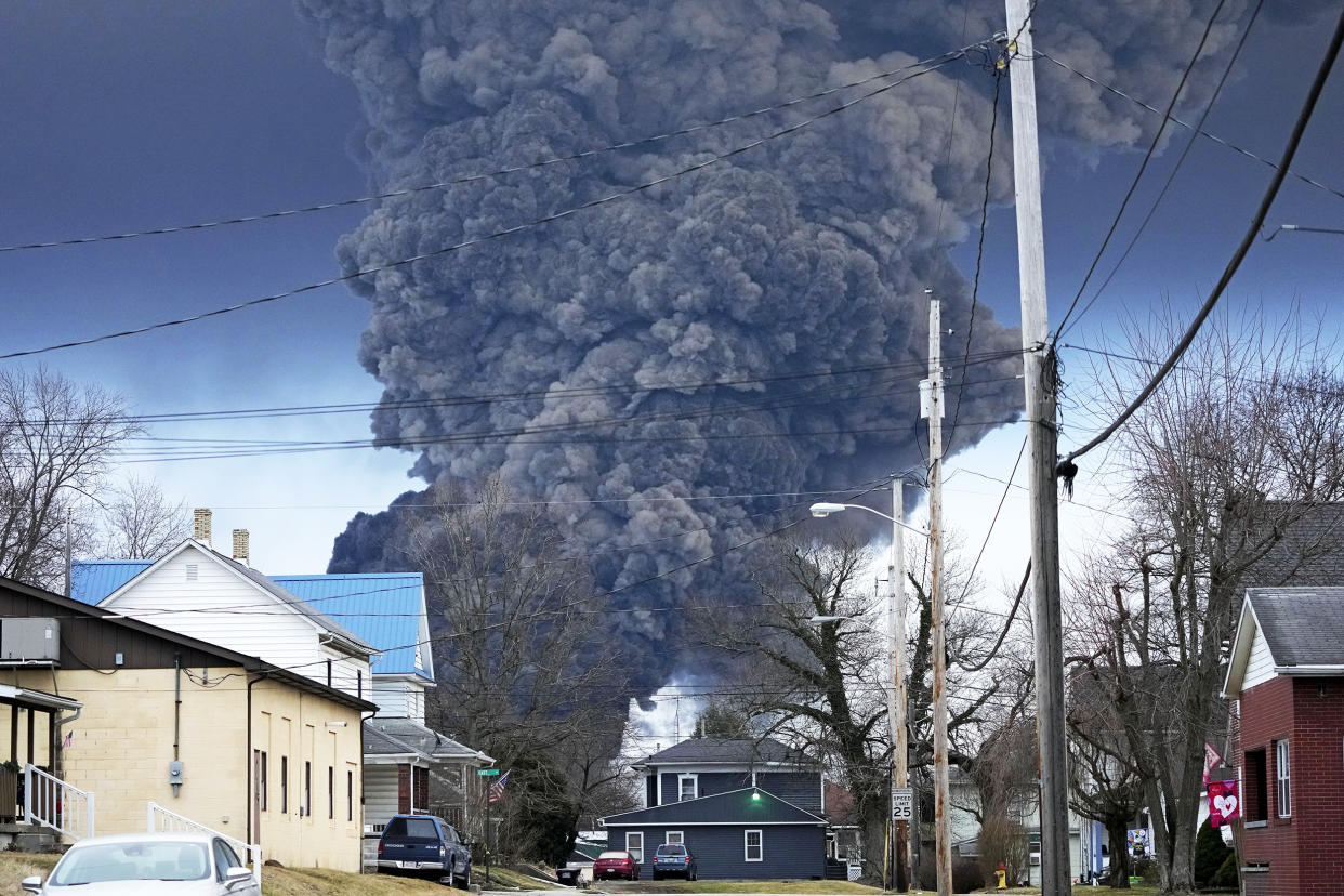 A black plume rises over East Palestine, Ohio, as a result of a controlled detonation of a portion of the derailed Norfolk and Southern trains Monday, Feb. 6, 2023. (Gene J. Puskar / AP)
