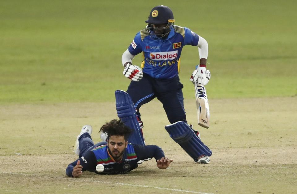 Sri Lanka's batsman Bhanuka Rajapaksa watch's as India's Nitish Rana attempts to field a ball during the third one day international cricket match between Sri Lanka and India in Colombo, Sri Lanka, Friday, July 23, 2021. (AP Photo/Eranga Jayawardena)