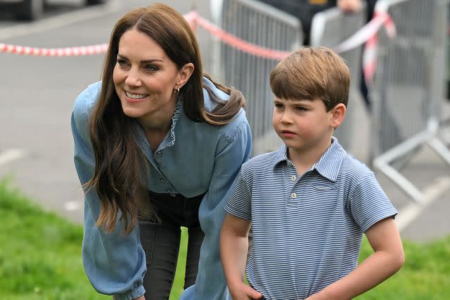 <p>Daniel Leal - WPA Pool/Getty</p> Prince Louis of Wales helps his mother, Catherine, Princess of Wales, take part in the Big Help Out, during a visit to the 3rd Upton Scouts Hut in Slough on May 8, 2023 in London, England