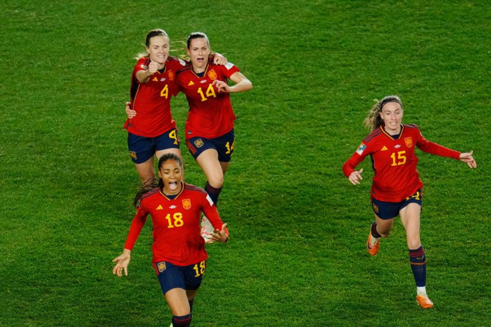 Spain players celebrate after teammate Olga Carmona scored her side's second goal during the Women's World Cup semifinal soccer match between Sweden and Spain (Abbie Parr / AP)