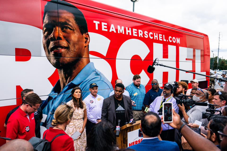 Herschel Walker and Former ambassador Nikki Haley speak with the press during Herschel's Unite Georgia Bus Stop rally at the Global Mall in Norcross, Ga., on Sept. 9, 2022. (Demetrius Freeman / The Washington Post via Getty Images file)