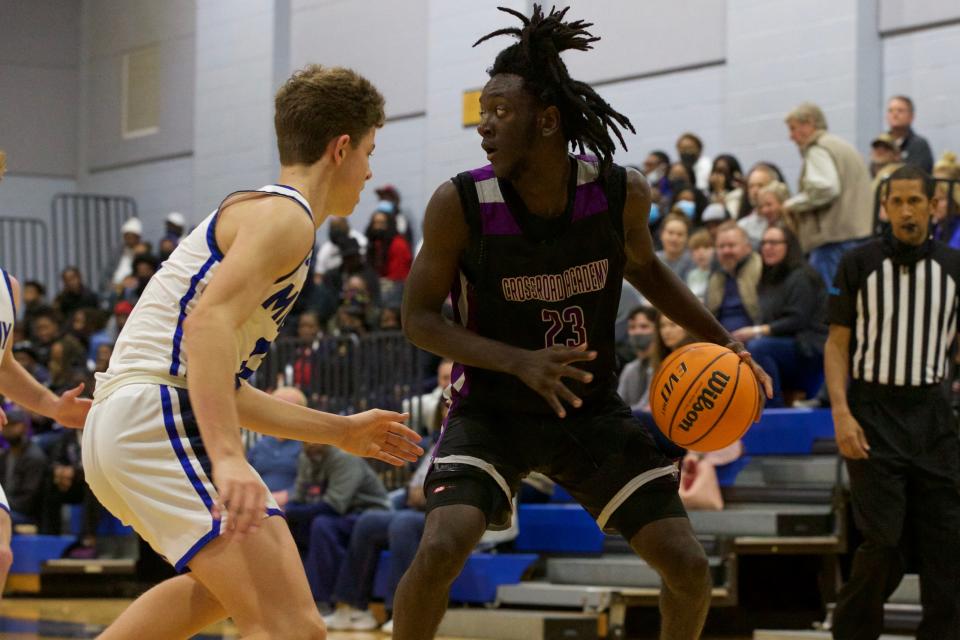 Crossroad junior Markel Bradwell (23) looks for an open player in a game against Maclay on Jan. 14, 2022, at Maclay School. The Marauders won 65-51.