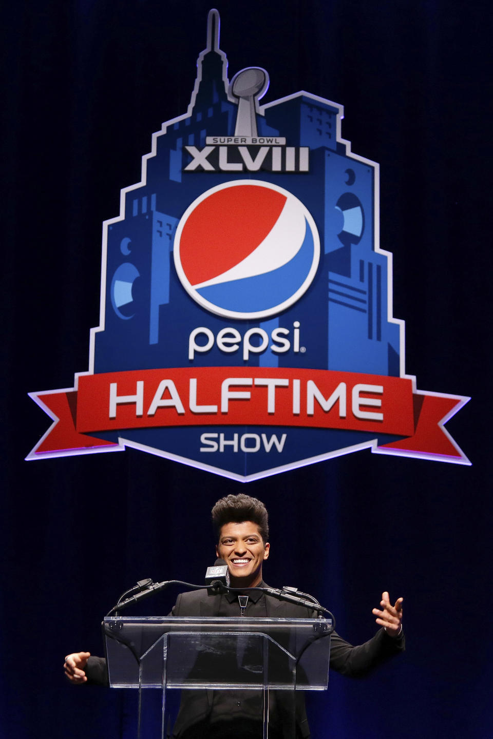 Bruno Mars who will headline the half-time show at the NFL Super Bowl XLVIII football game speaks during a press conference Thursday, Jan. 30, 2014, in New York. (AP Photo)