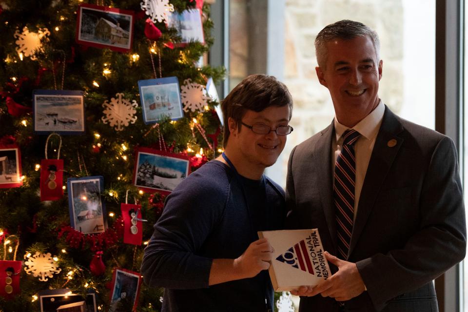 Commissioner Robert J. Harvie, Jr. poses for a portrait with guests after Waste Management's check presentation to the September 11th National Memorial Trail Alliance at Washington Crossing State Park Visitor Center in Washington Crossing on Wednesday, Nov. 30, 2022.