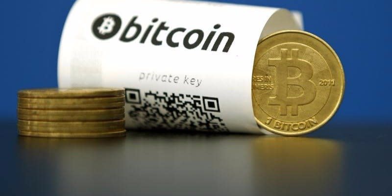 A Bitcoin (virtual currency) paper wallet with QR codes and a coin are seen in an illustration picture taken at La Maison du Bitcoin in Paris, France, May 27, 2015.  REUTERS/Benoit Tessier