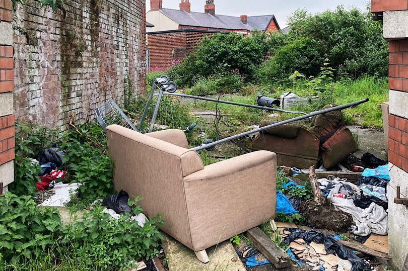 Fly tipping at the back of a building on Church Road, Seaforth