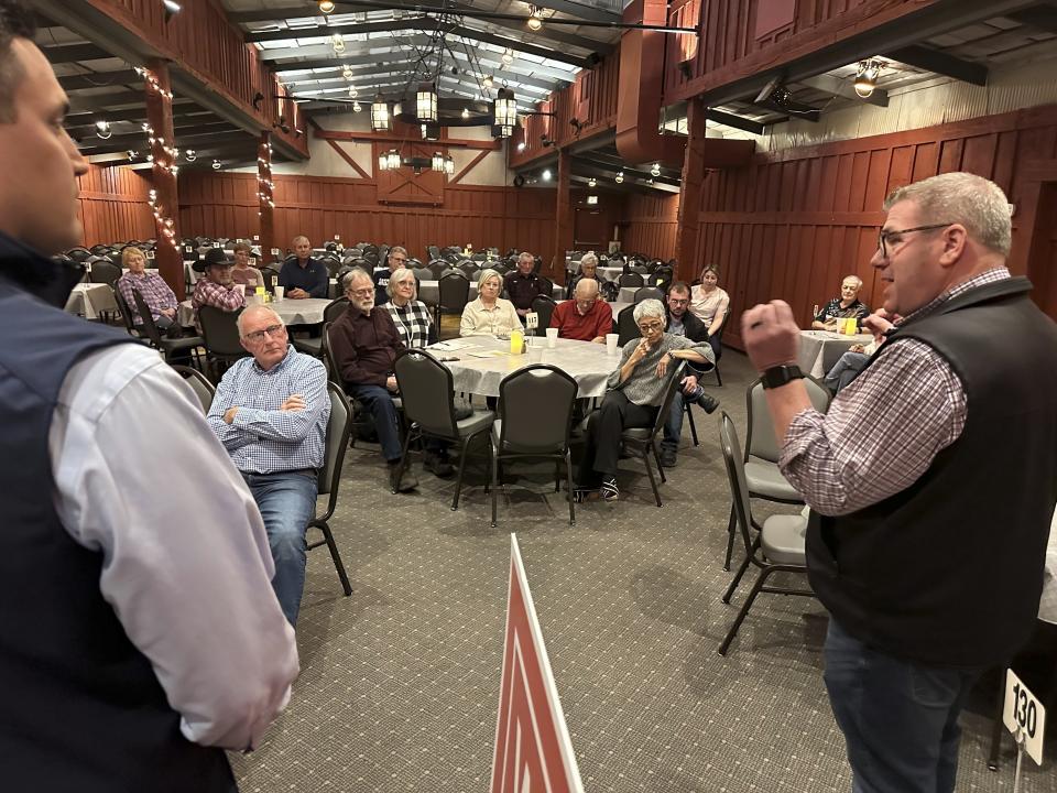 Congressional candidate Darren Bailey, right, speaks to a crowd at a restaurant during a campaign stop with state Rep. Adam Niemerg, Tuesday, Feb. 27, 2024, in Casey, Ill. Bailey, a former state senator and 2022 Republican nominee for governor, is running in the March 19th primary to unseat fellow GOP Congressman Mike Bost, a five-term incumbent who has the endorsement of former President Donald Trump, in Illinois' 12th District, which encompasses the bottom one-third of Illinois. (AP Photo/John O'Connor)