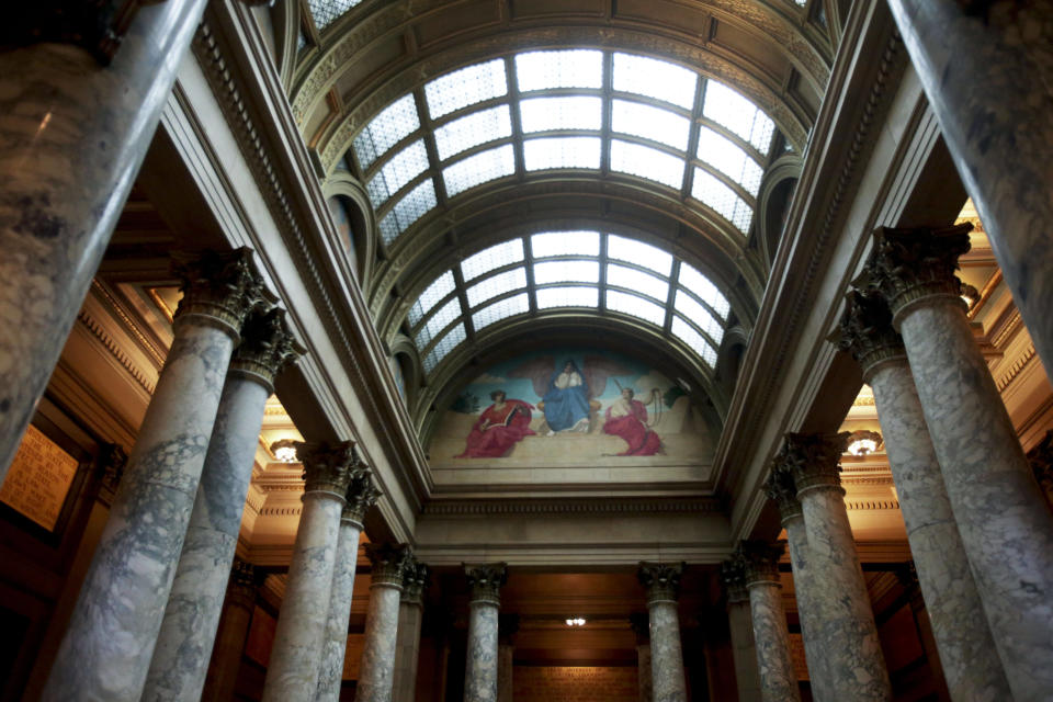 In this March 6, 2014 photo, the mural "Contemplative Spirit of the East" above the Supreme Court is shown at the Minnesota State Capitol in St. Paul, Minn. Beginning in the spring, work crews will take down paintings and sculpture and cover murals and statues as the renovation continues on the century old building. (AP Photo/Jim Mone)