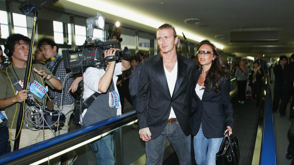 narita, japan june 18 english footballer david beckham and his wife victoria arrive at new tokyo international airport on june 18, 2003 in narita, chiba prefecture, japan the england mid fielder beckham 28, has ended weeks of speculation by agreeing personal terms on a four year contract from manchester united to spanish football giants real madrid, worth 245m photo by koichi kamoshidagetty images