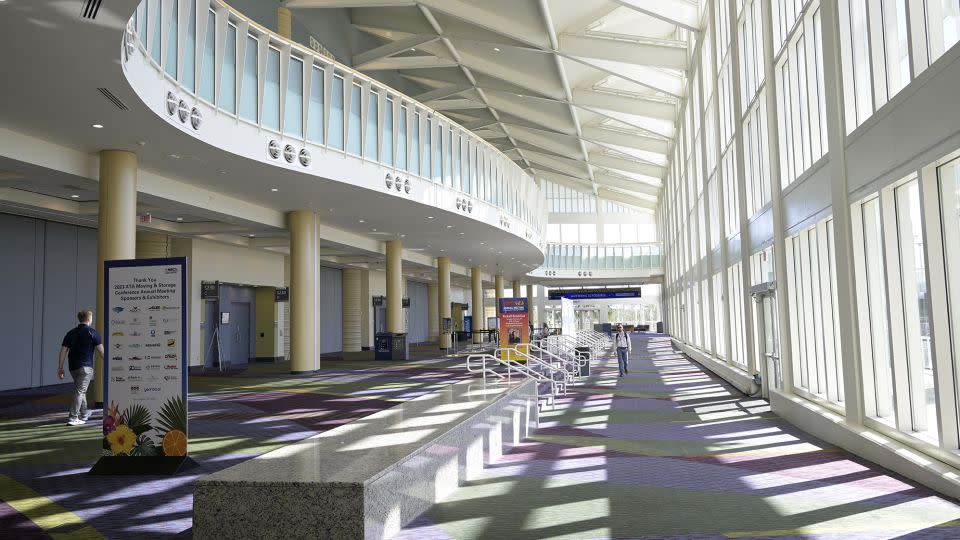 People walk through the interior of the Orange County Convention Center-South Concourse on Feb. 26, 2023, in Orlando.  - Phelan M. Ebenhack/AP