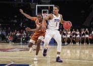 Apr 2, 2019; New York, NY, USA; Texas Christian Horned Frogs guard Desmond Bane (1) drives past Texas Longhorns guard Matt Coleman III (2) in the first half of the NIT semifinals at Madison Square Garden. Mandatory Credit: Wendell Cruz-USA TODAY Sports