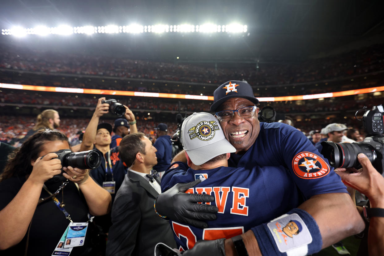 Jose Altuve and Astros manager Dusty Baker celebrate on the field after the Astros defeated the Philadelphia Phillies to win the 2022 World Series. (Photo by Rob Tringali/MLB Photos via Getty Images)