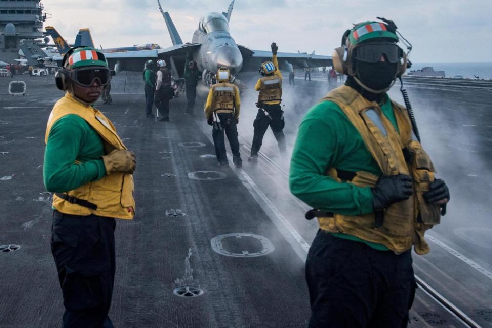 Sailors conduct flight operations on the aircraft carrier USS Carl Vinson (REUTERS)