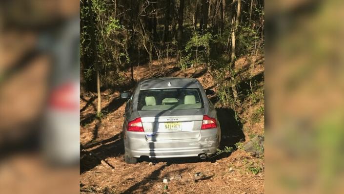 Brandon Augustine and Mildred Chestnut’s Volvo found abandoned and hidden at a mobile home park in Austell, Georgia. The couple is wanted on felony child abuse charges, CMPD said.