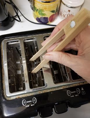 A magnetized wooden toaster tong