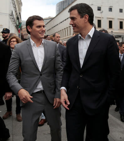 Ciudadanos Party leader Albert Rivera (L) and Socialist Party (PSOE) leader Pedro Sanchez walk next to each other during an event at Spanish parliament in Madrid, Spain, April 21, 2016. REUTERS/Andrea Comas