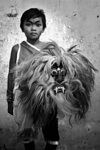 <div class="caption-credit"> Photo by: Diko Risanto</div>Indonesian photographer Diko Risanto's portrait of a child posed with a Jaranan dance mask. <br>