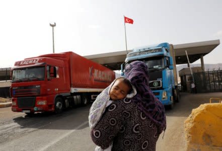 Trucks enter Turkey from Iraq at Habur border gate near Silopi, Turkey, September 25, 2017. REUTERS/Umit Bektas