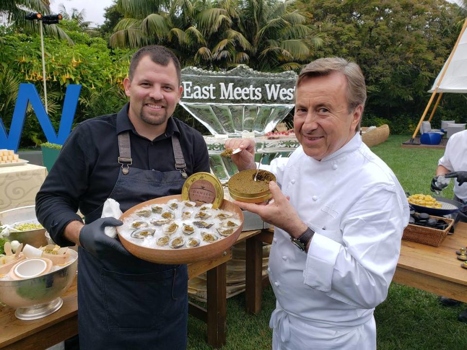 Morro Bay Oyster Co. owner Neal Maloney, left, holds oysters with Chef Daniel Boulud, right, holding caviar, during an event at the Biltmore Four Seasons in Santa Barbara.