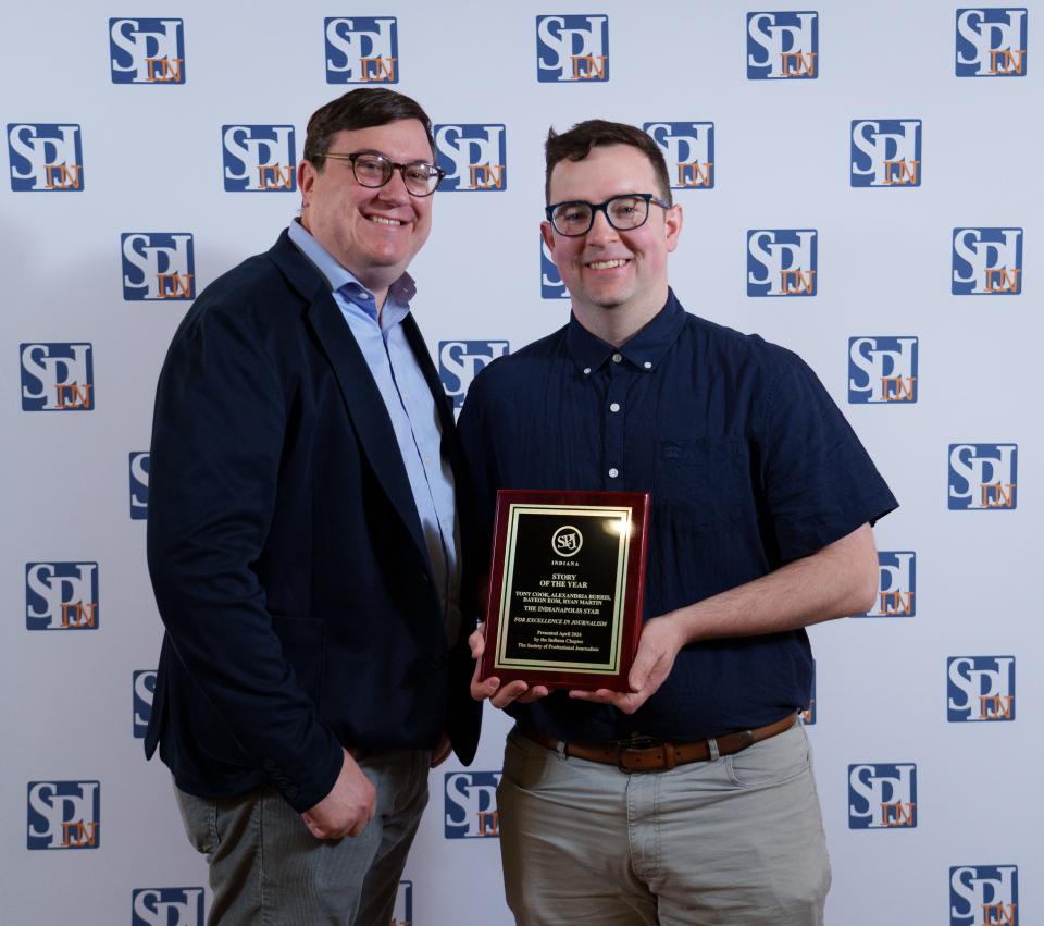 IndyStar investigative reporter Tony Cook and Mirror Indy Deputy Managing Editor Ryan Martin hold the "Story of the Year" plaque at the Indiana Professional Chapter of the Society of Professional Journalists 2023 Best of Indiana Journalism awards on April 26, 2024. Cook, Martin, and IndyStar reporters Alexandria Burris and Dayeon Eom received the award for reporting on troubled bars in Indianapolis.