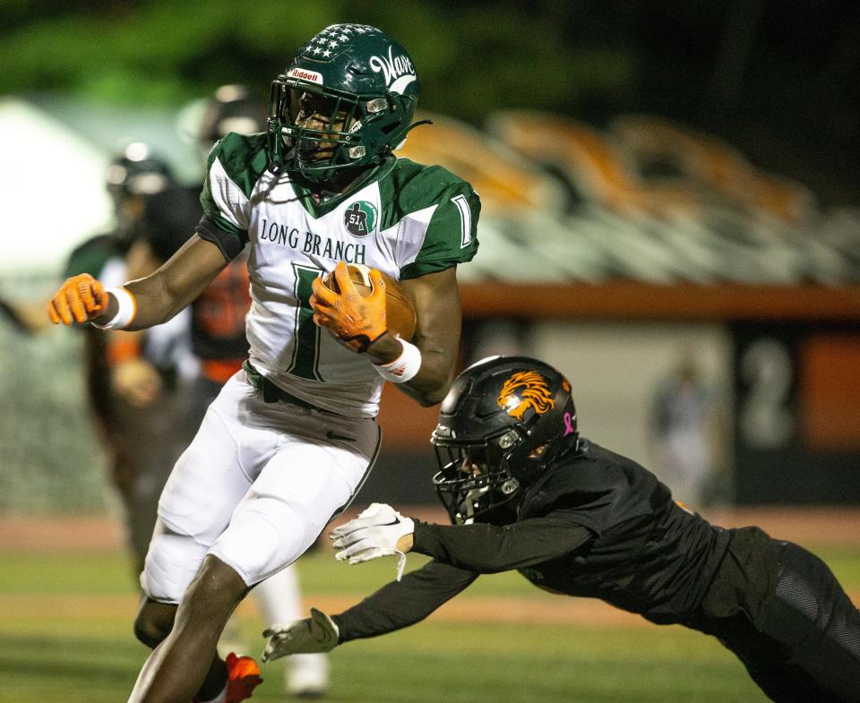 Sekou Kamau of Long Branch gains yards on the ground. Long Branch at Middletown North football.   Middletown, NJFriday, October 7, 2022