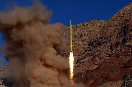 FILE PHOTO: A ballistic missile is launched and tested in an undisclosed location, Iran, in this handout photo released by Farsnews on March 9, 2016. REUTERS/farsnews.com/Handout via Reuters