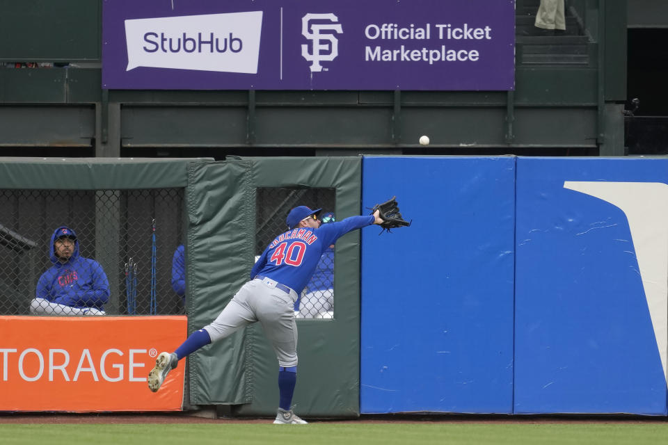 Chicago Cubs center fielder Mike Tauchman catches a fly out hit by San Francisco Giants' Brandon Crawford during the third inning of a baseball game in San Francisco, Saturday, June 10, 2023. (AP Photo/Jeff Chiu)