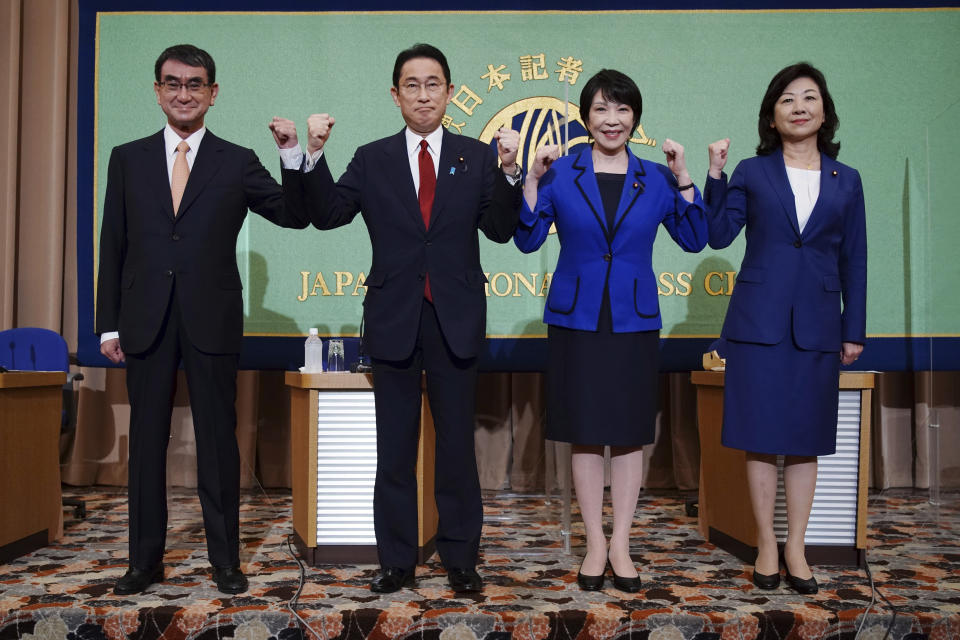 Candidates for the presidential election of the ruling Liberal Democratic Party pose prior to a debate session hosted by the Japan National Press Club Saturday, Sept. 18, 2021 in Tokyo. The contenders are, from left, Taro Kono, the cabinet minister in charge of vaccinations, Fumio Kishida, former foreign minister, Sanae Takaichi, former internal affairs minister, and Seiko Noda, former internal affairs minister. (AP Photo/Eugene Hoshiko, Pool)