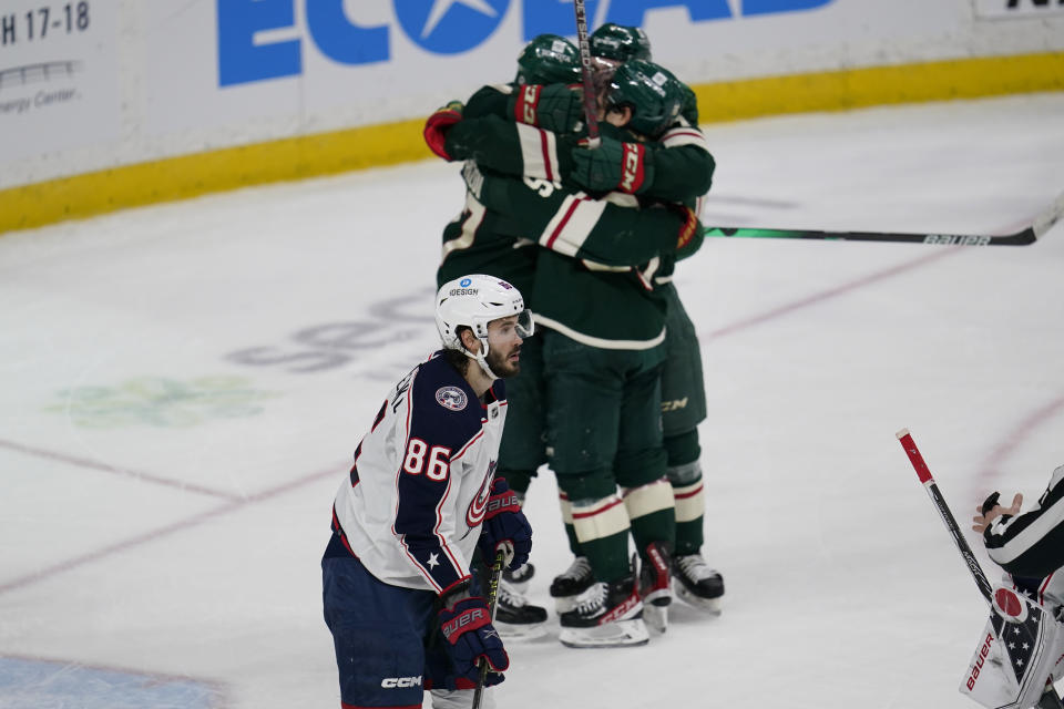 Columbus Blue Jackets right wing Kirill Marchenko (86) reacts after an overtime loss to the Minnesota Wild in an NHL hockey game Sunday, Feb. 26, 2023, in St. Paul, Minn. (AP Photo/Abbie Parr)