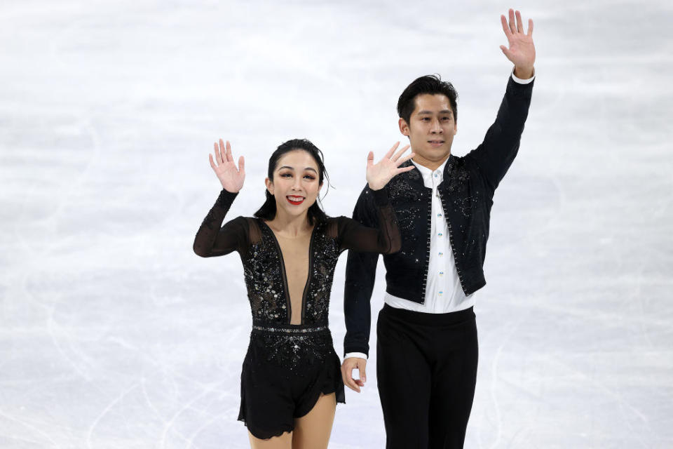 Wenjing and Cong waving in 2022