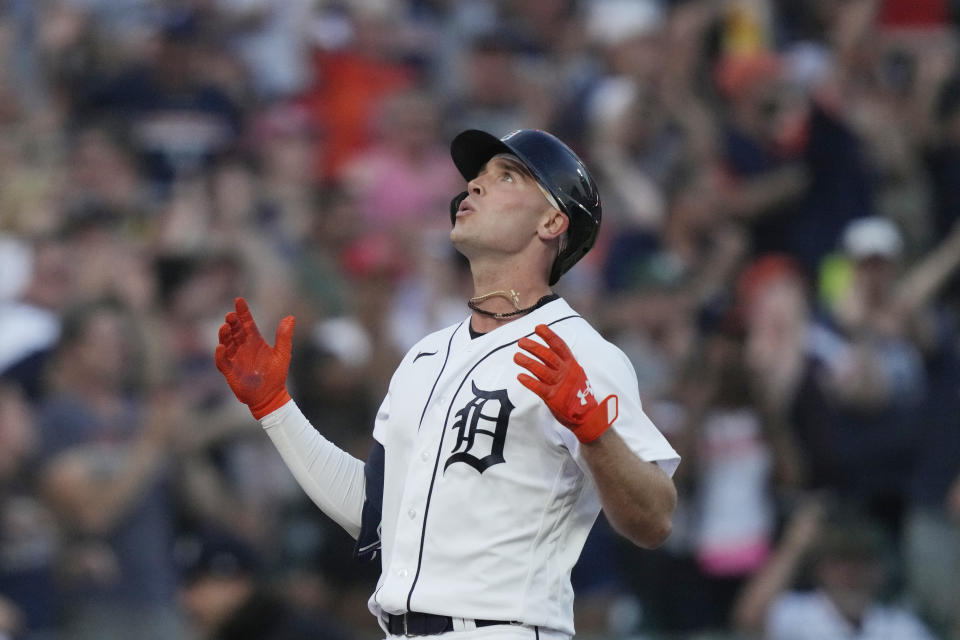 Detroit Tigers' Kerry Carpenter looks skyward as he approaches home plate after his three-run home run during the seventh inning of a baseball game against the Kansas City Royals, Monday, June 19, 2023, in Detroit. (AP Photo/Carlos Osorio)