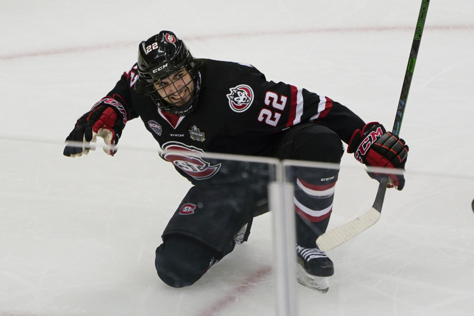 St. Cloud State's Joe Molenaar (22) celebrates after scoring the tying goal against Minnesota State during the third period of an NCAA men's Frozen Four hockey semifinal in Pittsburgh, Thursday, April 8, 2021. St. Cloud State won 5-4 to advance to the championship game Saturday. (AP Photo/Keith Srakocic)