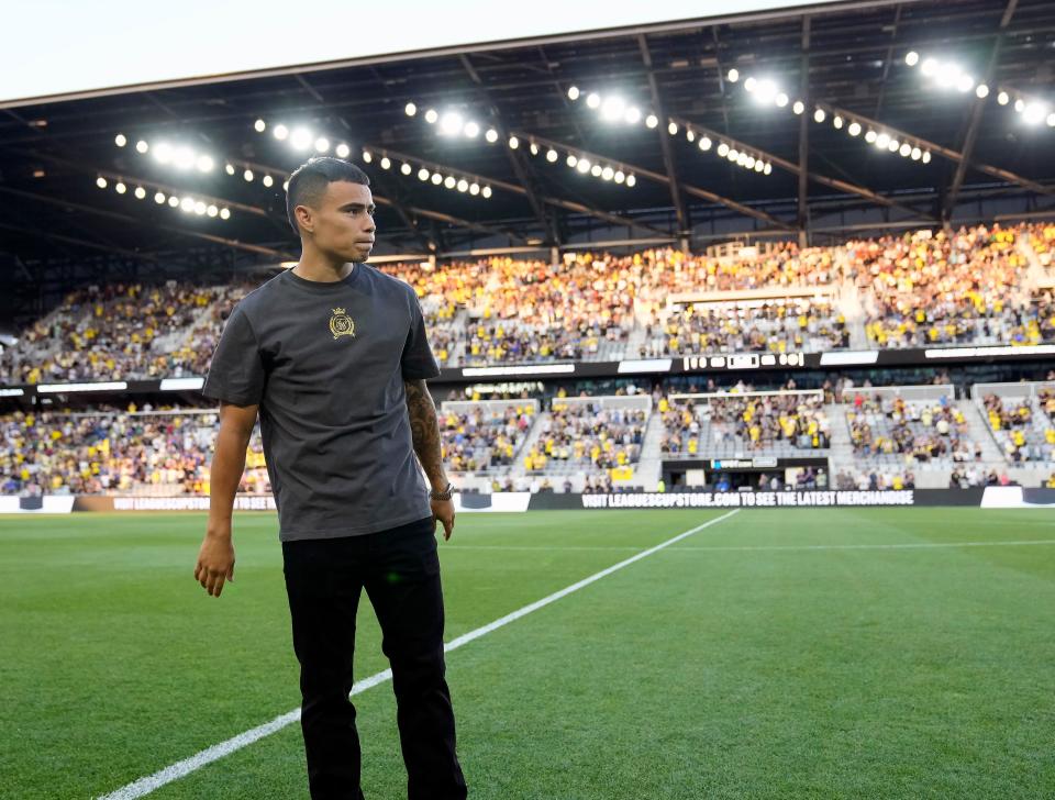 Former Crew star Lucas Zelarayan speaks to the fans before Monday's game against Club America.