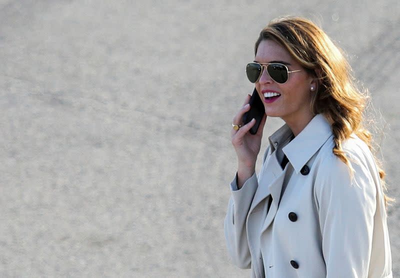 FILE PHOTO: White House counselor to the president Hope Hicks uses her smartphone at a campaign event for U.S. President Donald Trump at Dayton International Airport in Dayton