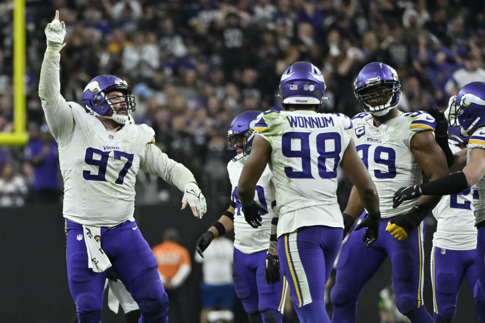 Minnesota Vikings defensive tackle Harrison Phillips (97) celebrates a sack against the Las Vegas Raiders during the second half of an NFL football game, Sunday, Dec. 10, 2023, in Las Vegas. (AP Photo/David Becker)