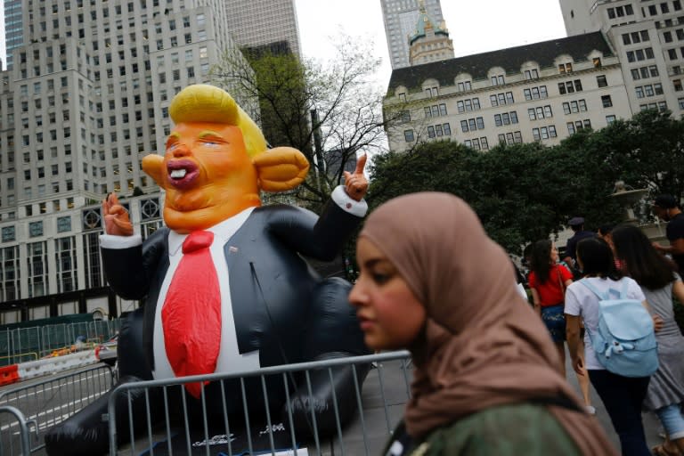 Protesters gather outside Trump Tower in New York to demonstrate against US President Donald Trump on August 14, 2017