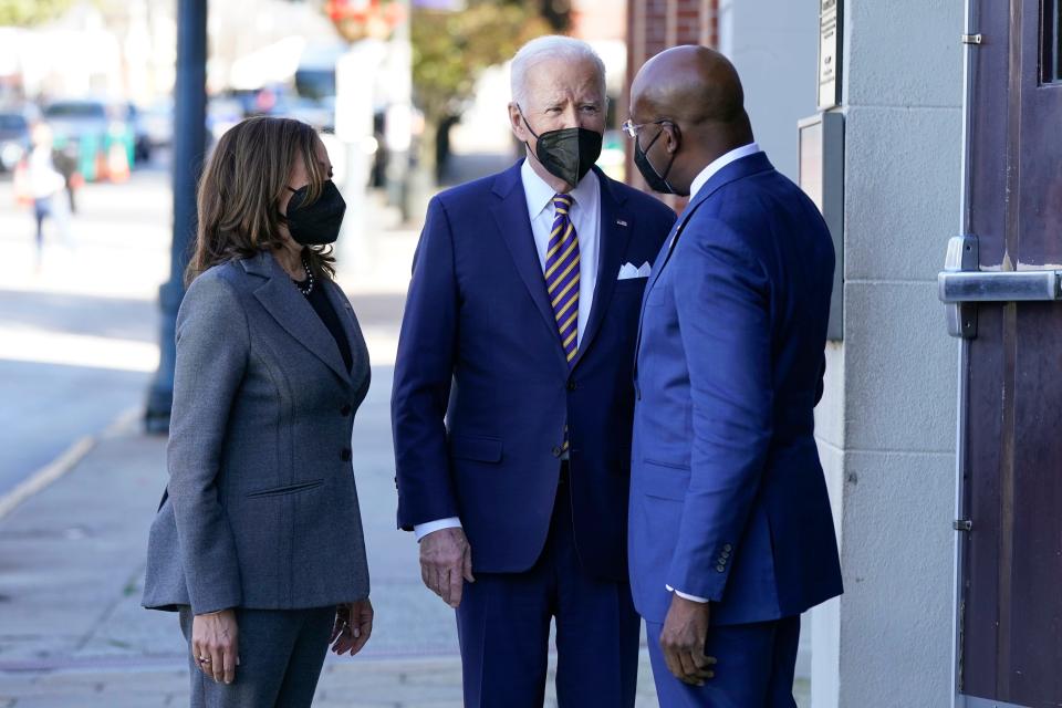 President Joe Biden and Vice President Kamala Harris greet Sen. Raphael Warnock, D-Ga., as they arrive for a visit to Ebenezer Baptist Church, Tuesday, Jan. 11, 2022, in Atlanta.