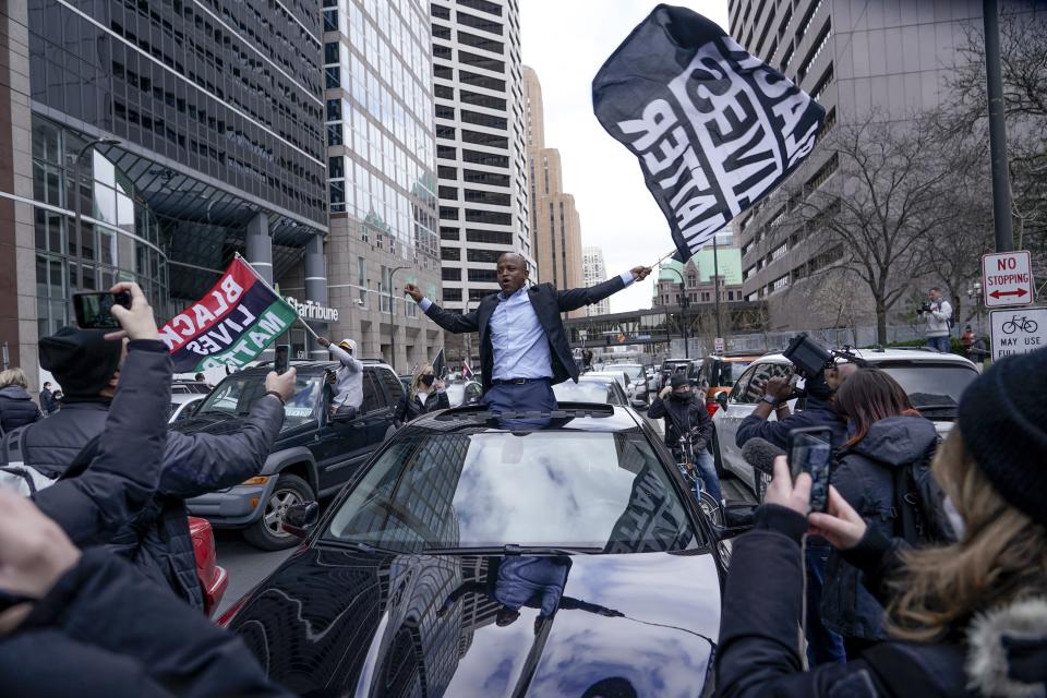 People rally outside the courthouse in Minneapolis on Tuesday, April 20, 2021, after the guilty verdicts were announced in the trial of former Minneapolis police officer Derek Chauvin in the death of George Floyd. (AP Photo/Morry Gash)