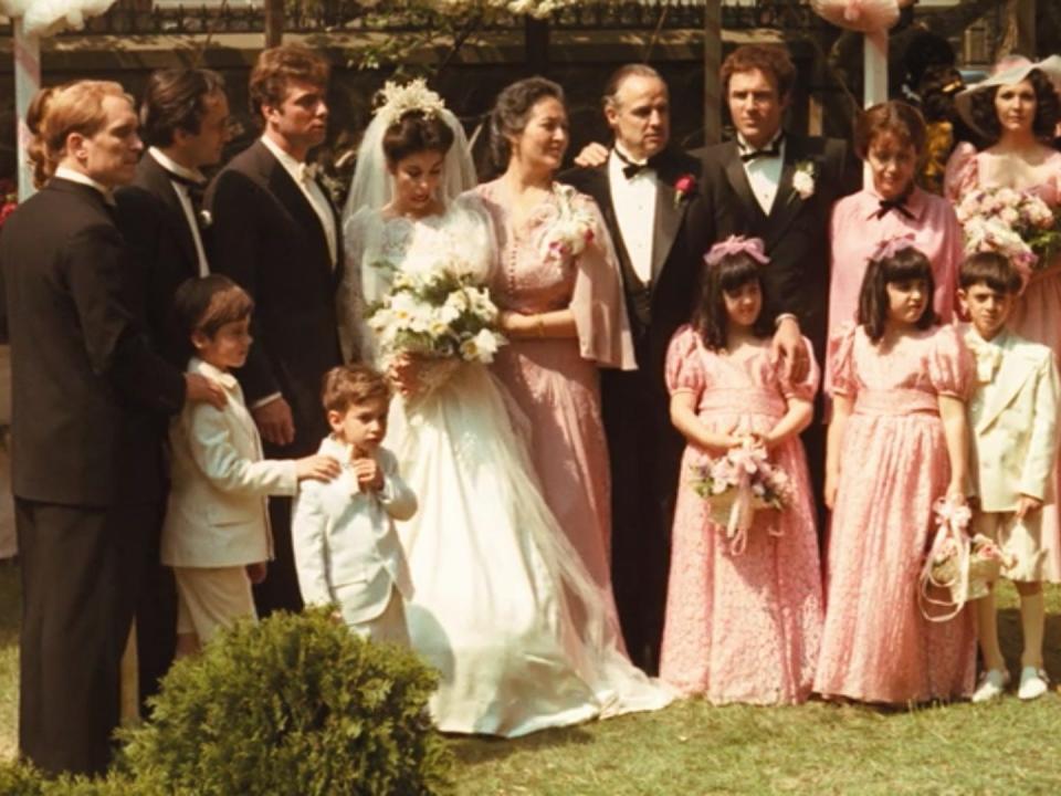 A portrait of the Corleone wedding party outdoors.