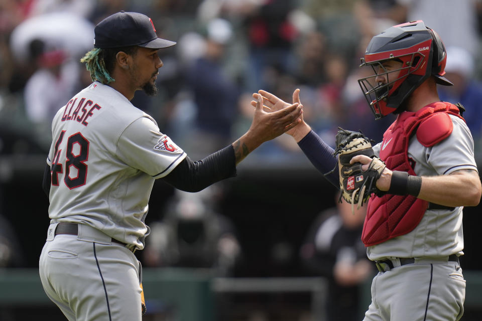 Cleveland Guardians relief pitcher Emmanuel Clase, left, slaps hands with catcher Cam Gallagher after striking out Chicago White Sox's Seby Zavala to end the game, Thursday, May 18, 2023, in Chicago. The Guardians won 3-1. (AP Photo/Erin Hooley)