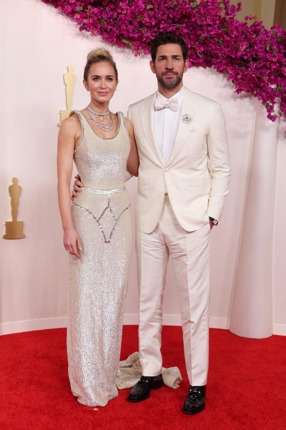 Emily Blunt and John Krasinski matched with their looks, both looking incredible in their matching white looks. Photo: Getty