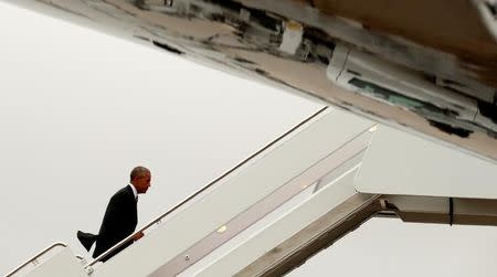 U.S. President Barack Obama boards Air Force One as he departs Joint Base Andrews in Washington on his way to Israel to attend the funeral of Shimon Peres in Jerusalem September 29, 2016. REUTERS/Kevin Lamarque