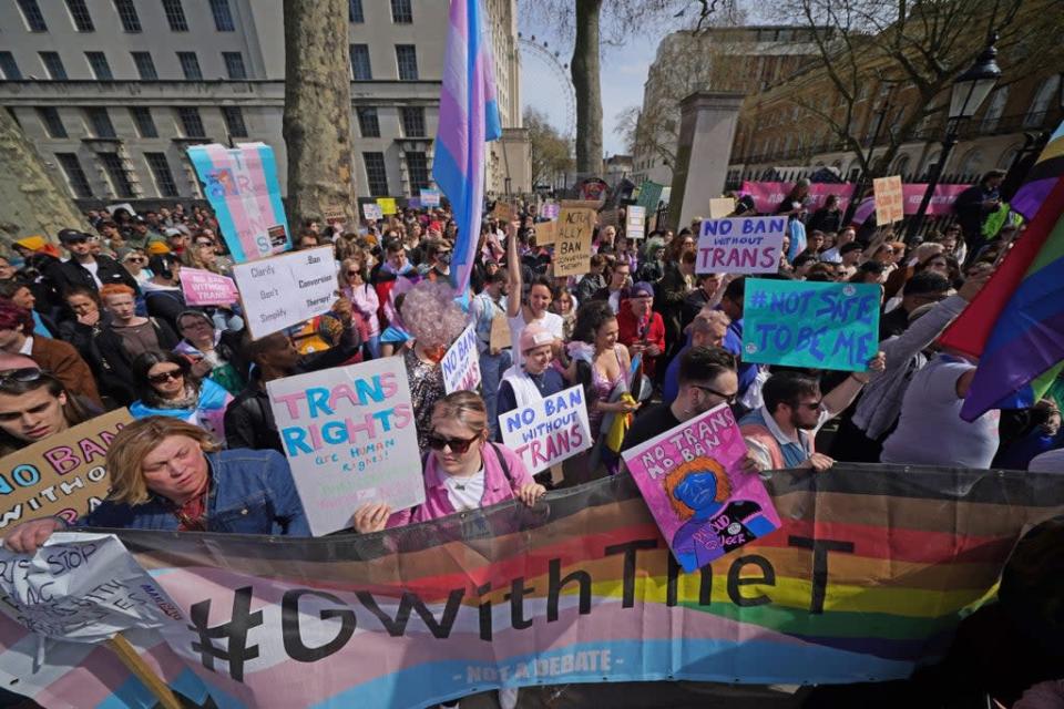People take part in a demonstration outside Downing Street in London, to protest against the exclusion of transgender people from a ban on conversion therapy (Yui Mok/PA) (PA Wire)