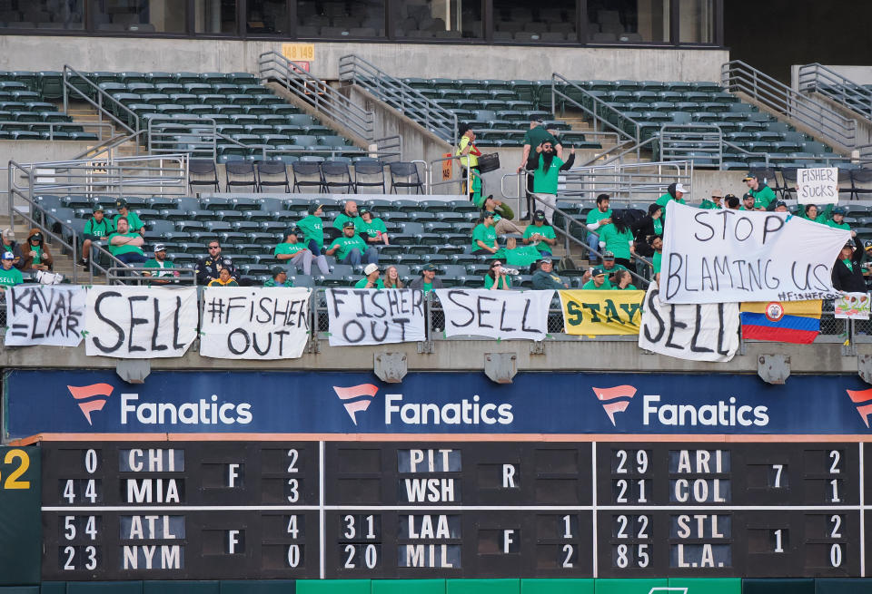 Apr 28, 2023; Oakland, California, USA; Signs referencing the Oakland Athletics plan to move to Las Vegas during the fourth inning against the Cincinnati Reds at Oakland Coliseum. Mandatory Credit: Kelley L Cox-USA TODAY Sports